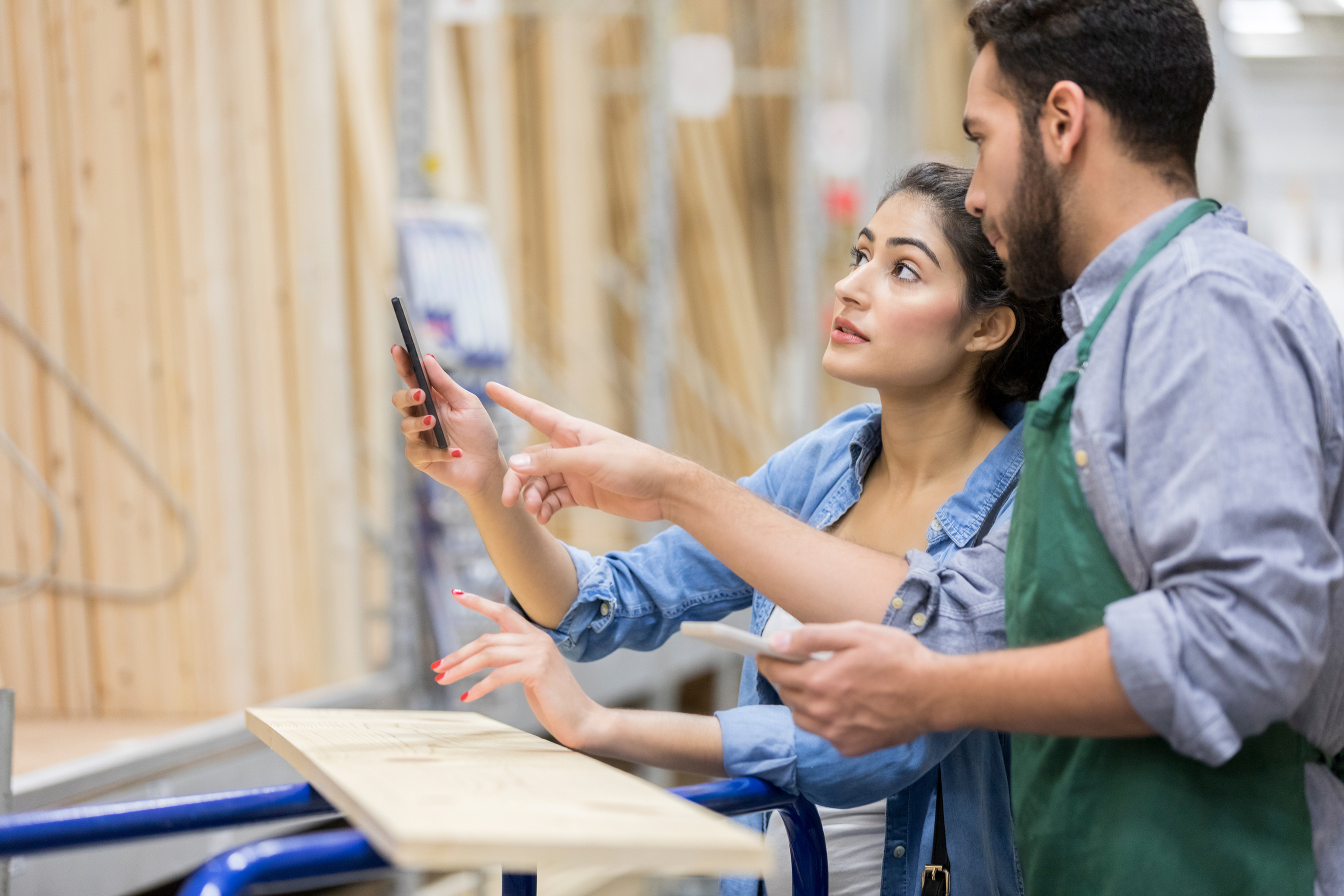Home improvement female customer receives assistance from sales associate